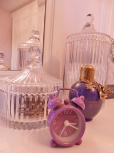 Tiny purple alarm clock, Taylor Swift Love Struck Perfume and two vintage jars from Next.